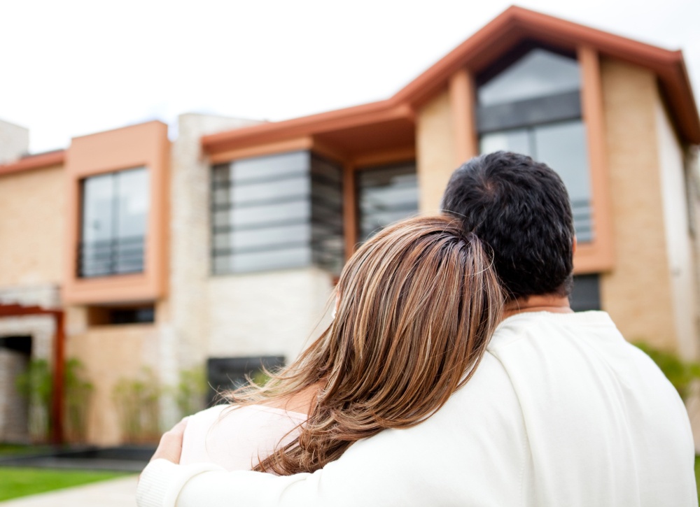 couple cuddling house