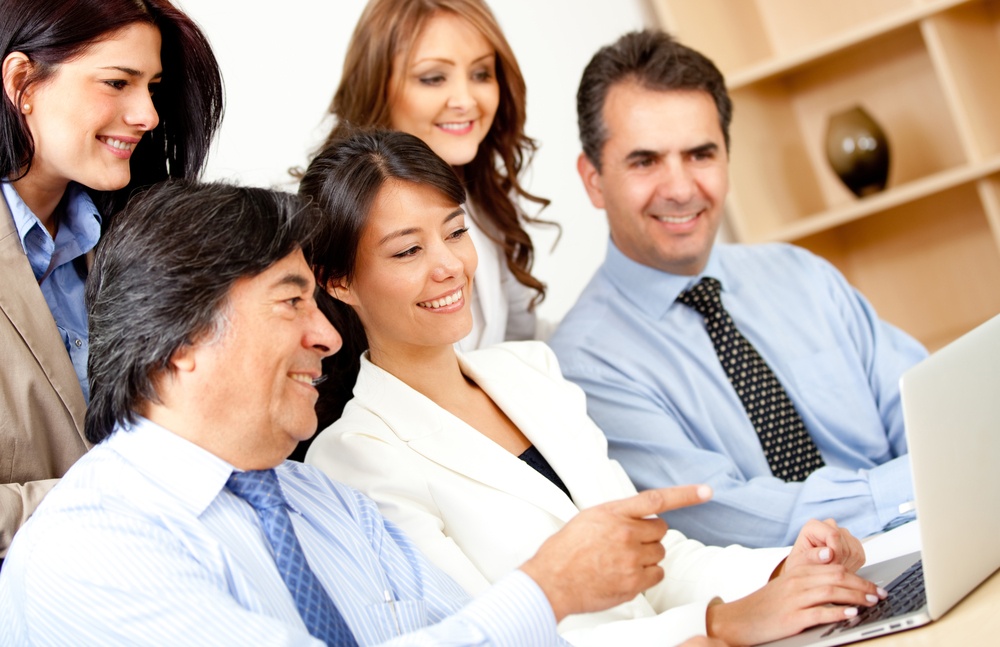 coworkers looking at computer