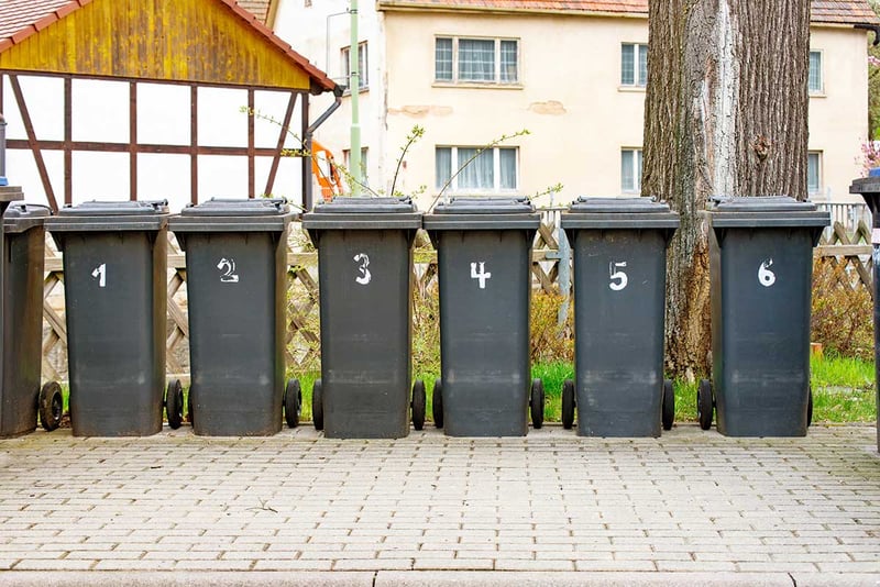 Trashcans in a row on street