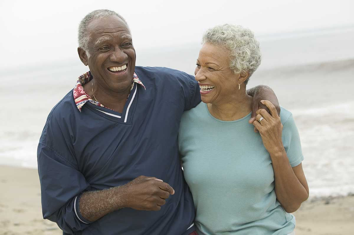 cheerful couple at beach