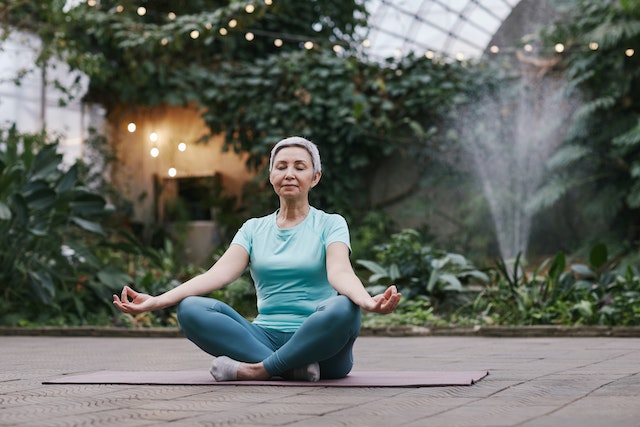 older woman doing yoga