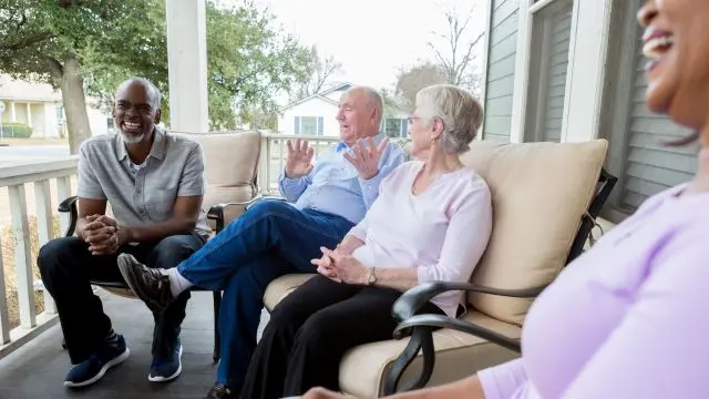 neighbors sitting on porch in HOA community