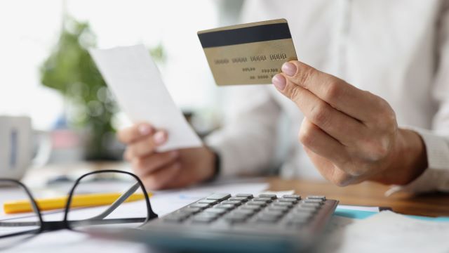 person holding credit card